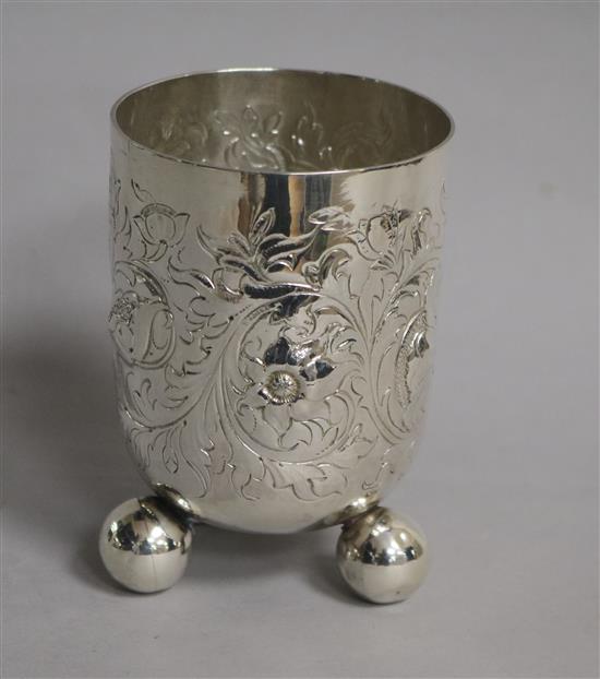 A 19th? century embossed silver beaker, with hallmarks for London Assay Office, London, 1999, 4.75 oz.